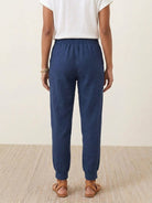 Woman wearing relaxed chic elastic ankles pants with a comfortable and flattering fit
