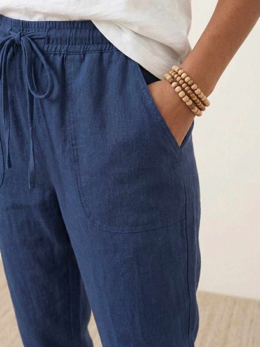 Woman wearing relaxed chic elastic ankles pants with casual styling and comfortable fit