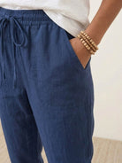 Woman wearing relaxed chic elastic ankles pants with casual styling and comfortable fit