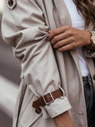Sleek minimalist hooded coat in oversized fit for travel and layering