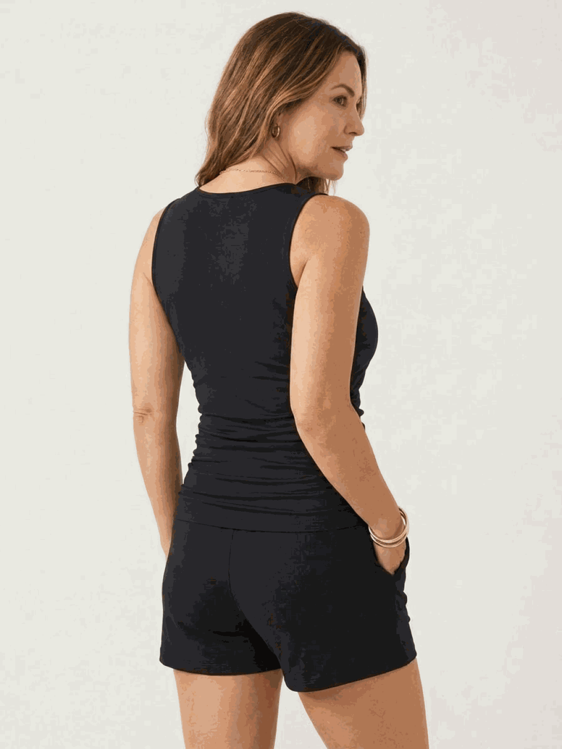 High-neck ruched tankini set with gathered side seams and built-in brief for swim skirt or shorts style