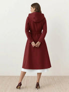 Water-repellent A-line hooded raincoat with insulated lining and belt for women