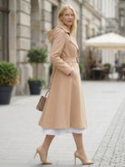 Elegant water-repellent A-line hooded raincoat for women with insulated lining and matching belt