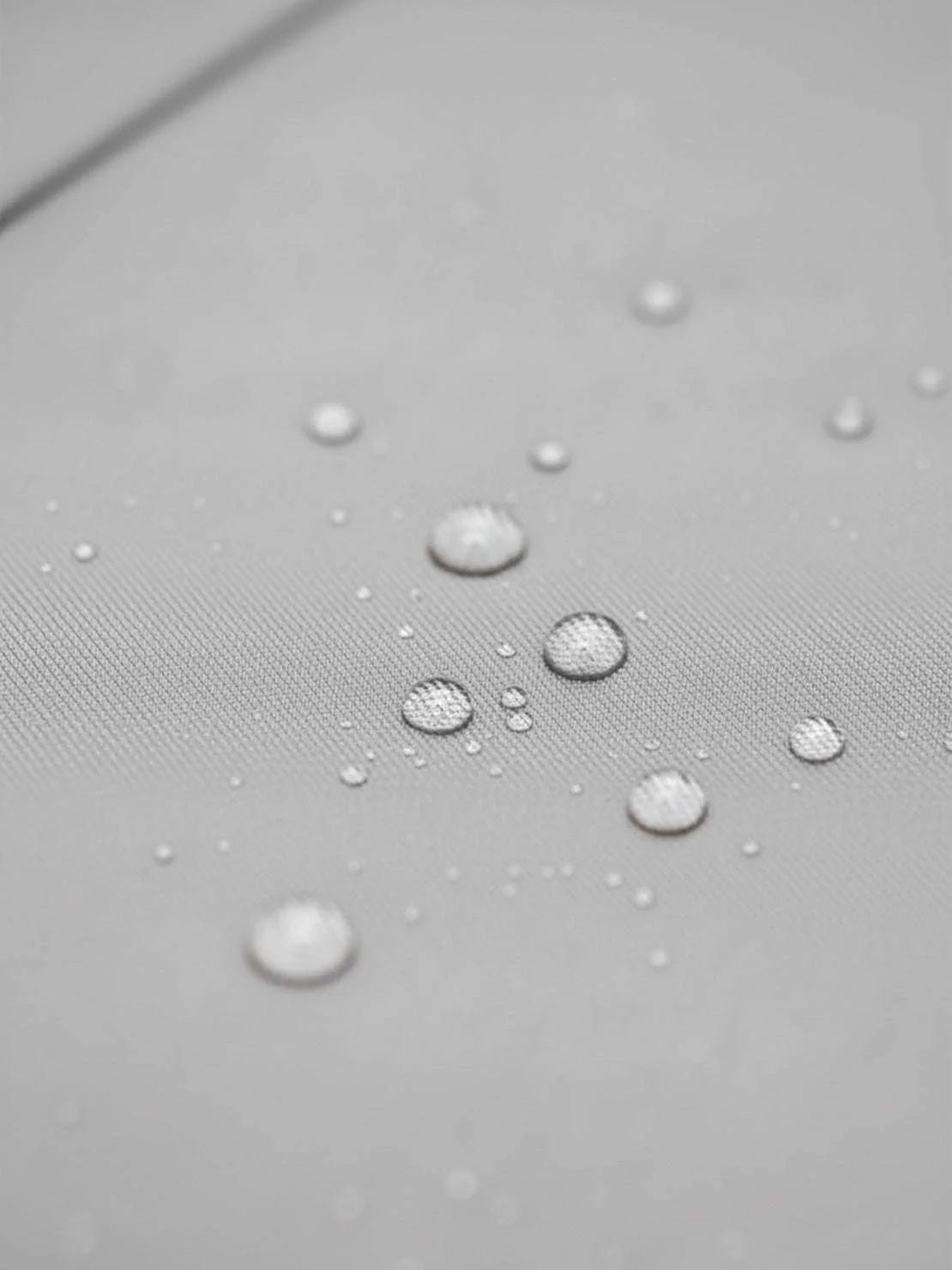 Elegant water-repellent A-line hooded raincoat with insulated lining and belt for women