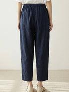 Woman wearing breezy relaxed fit straight pants in a stylish casual outfit