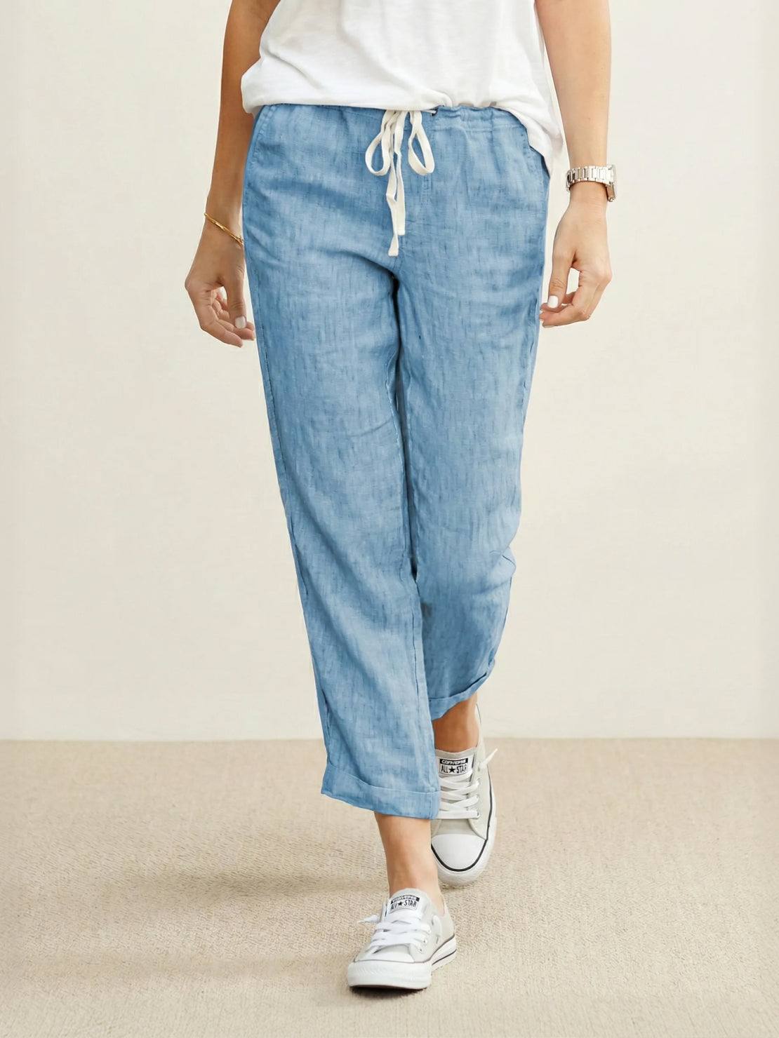 woman wearing breezy relaxed fit straight pants standing outdoors