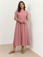 Elegant capped-sleeve voluminous pleated midi dress with flowy skirt and pockets