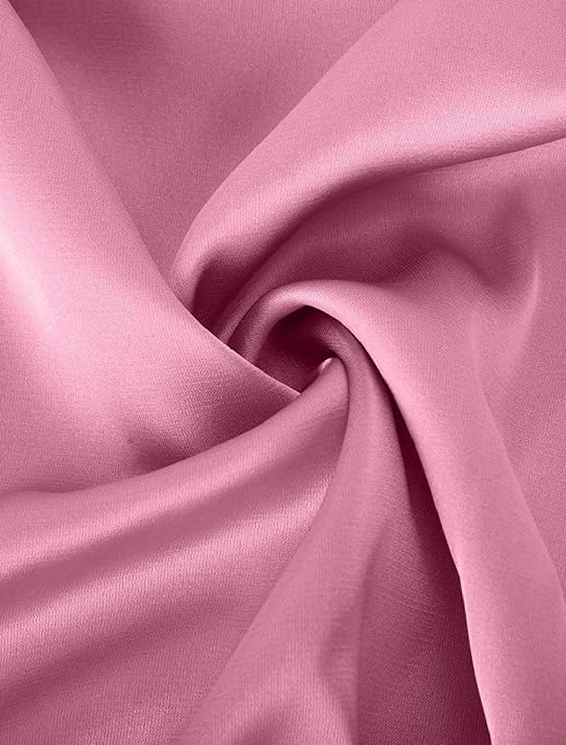 Woman wearing elegant layers two-piece set with layered V-neck top and matching pants in soft fabric