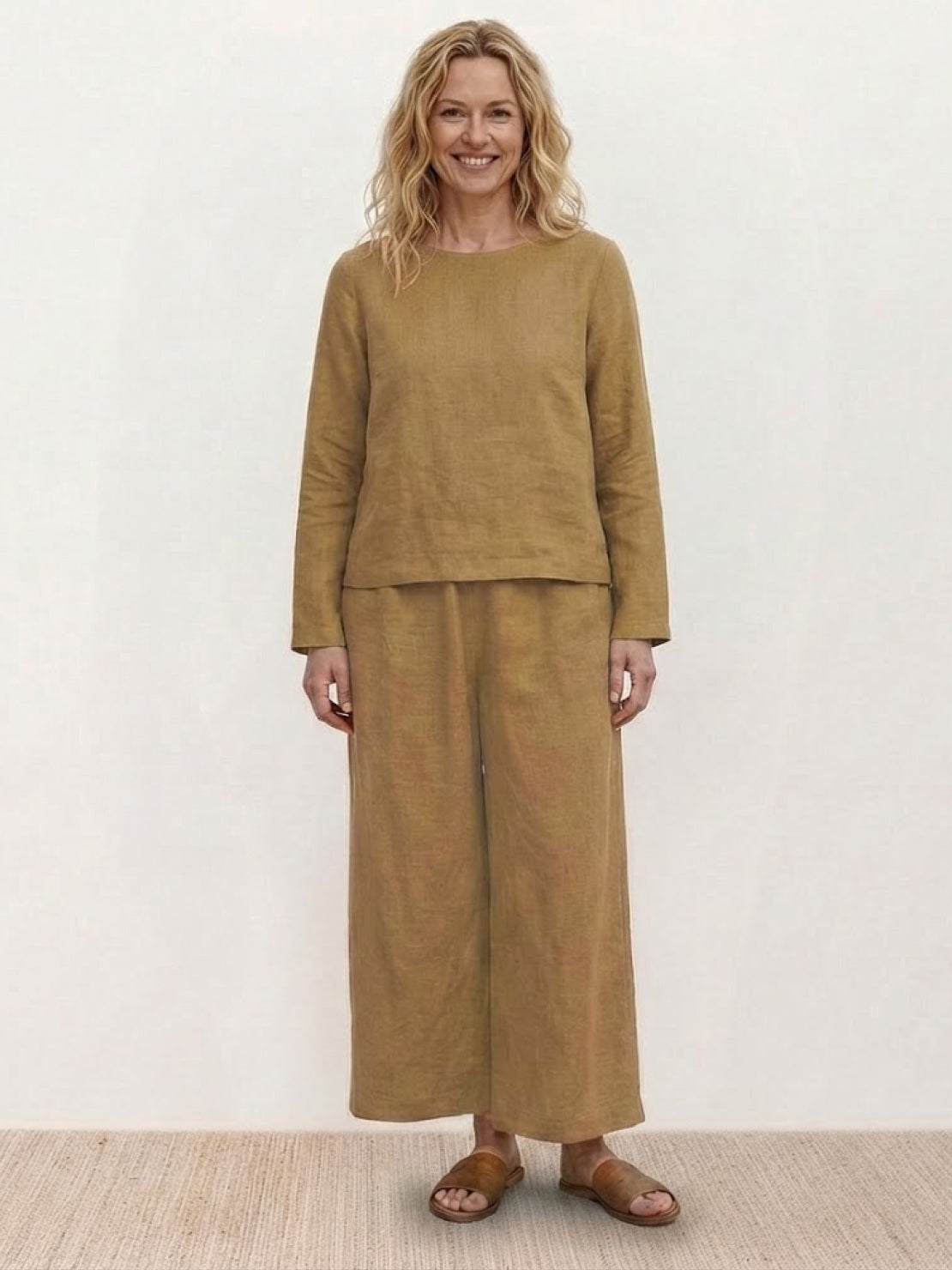 Loose solid color two-piece set with breathable, lightweight fabric and classic round-neck pullover and wide-leg pants