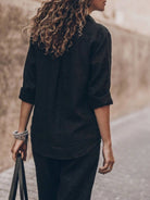 Model wearing oversized 100% cotton shirt and wide-leg pants co-ord set in relaxed fit and breathable fabric
