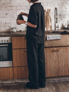 woman wearing oversized 100 cotton shirt and wide-leg pants co-ord set standing outdoors