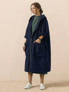 One size oversized water-resistant windbreaker jacket with waterproof design, attached hood, and large front pockets.