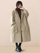 One size waterproof oversized windbreaker jacket with hood and large pockets for versatile layering and stylish coverage