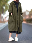 oversized water-resistant windbreaker jacket with attached hood and large front pockets in olive green waterproof design