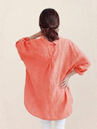 Oversized linen shirt in soft white cotton-linen blend with relaxed fit and back button detail