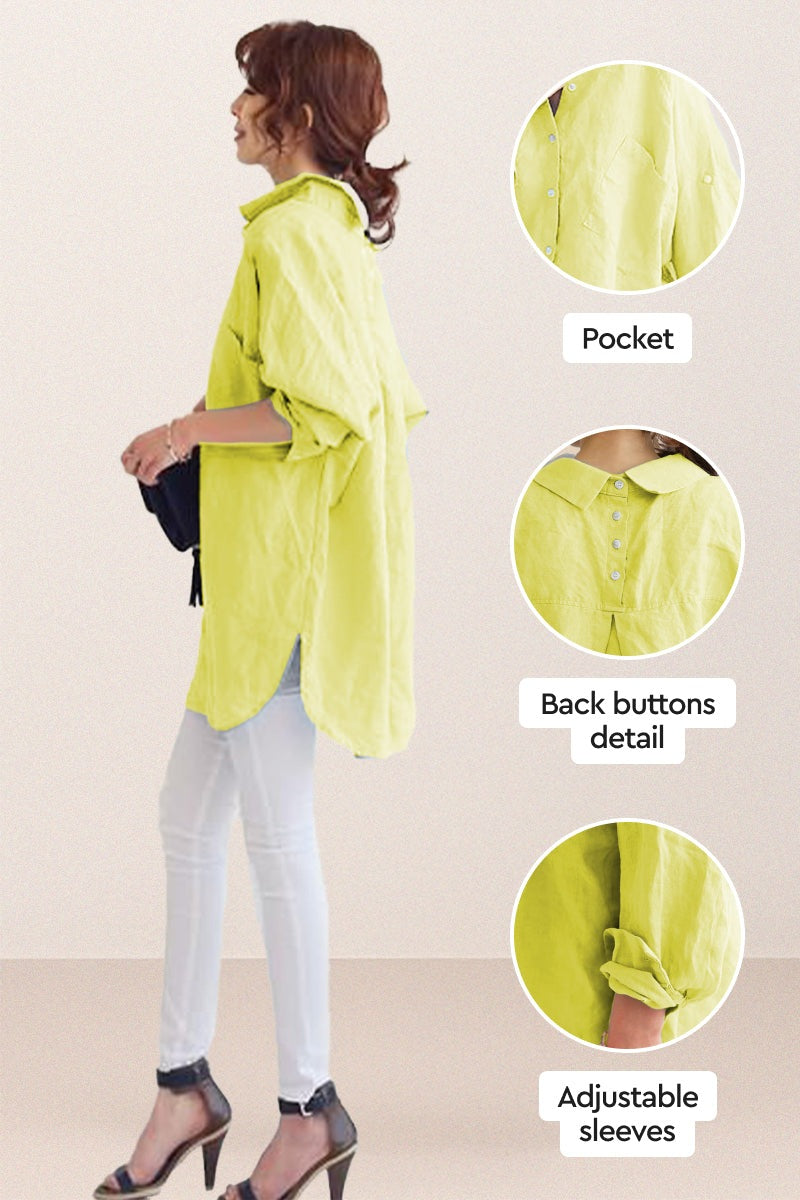 Side view of oversized linen shirt in lime green with back button detail, pocket, and adjustable rolled sleeves worn with white pants and black heels