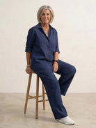 Model wearing oversized 100% cotton shirt with wide-leg pants co-ord set in breathable fabric