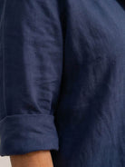 Woman wearing oversized 100% cotton shirt and wide-leg pants co-ord set