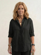 Model wearing oversized 100% cotton shirt and wide-leg pants co-ord set in relaxed silhouette