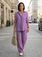 Model wearing oversized 100% cotton shirt with wide-leg pants co-ord set in neutral tones