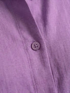 Woman wearing oversized 100% cotton shirt and wide-leg pants co-ord set