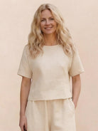 Woman wearing The Meadow loose fit co-ord set with soft-tailored top and wide-leg bottoms in solid color