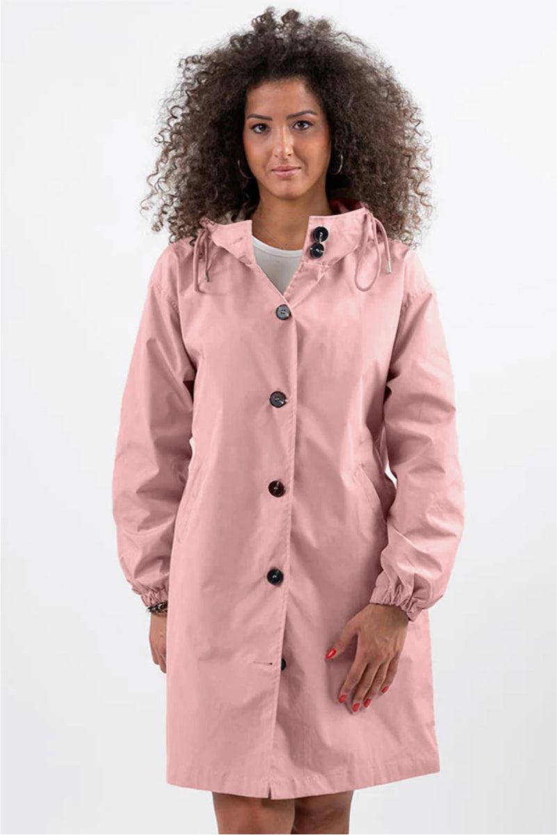 Trendy oversized pink Rain Couture Windbreaker jacket with adjustable hood and button closure