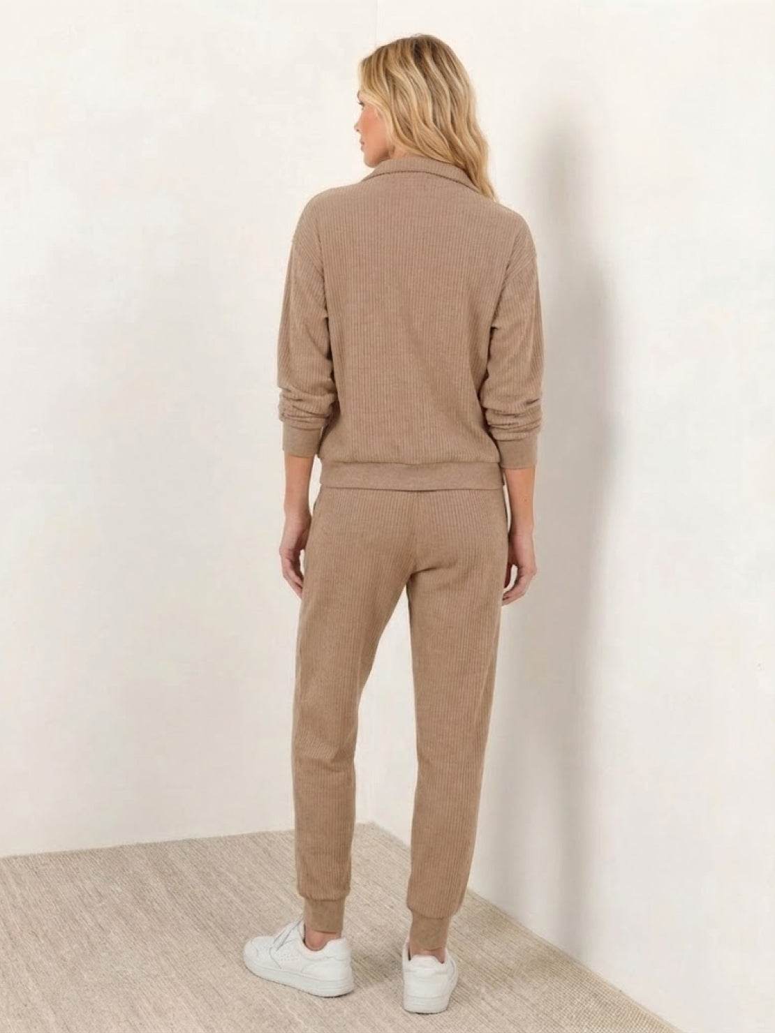 Unisex half-zip pullover and sweatpants set in relaxed fit with soft fabric for casual wear and travel
