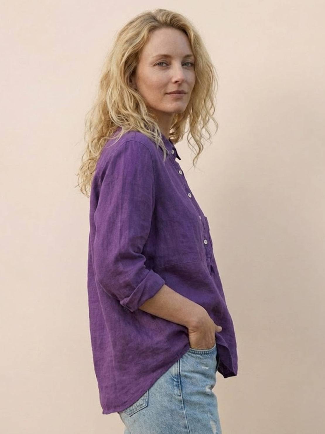 Woman wearing a breathable vintage linen shirt made of cotton-linen blend, styled casually for warm weather and travel