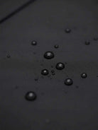 Women’s water-repellent A-line hooded raincoat with belt and insulated lining