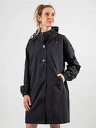 Water-resistant oversized windbreaker rain jacket with hood and multiple pockets for outdoor activities