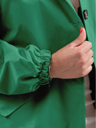 water-resistant oversized hooded windbreaker rain jacket with pockets for outdoor activities